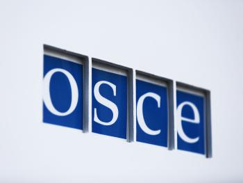 The OSCE logo on the main gate outside Secretariat's premises.