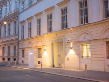 The main gate of the OSCE Secretariat in the evening.